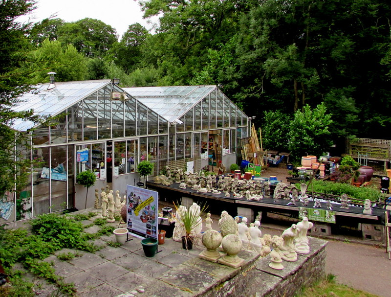 A row of greenhouses lined up for sale at a garden centre